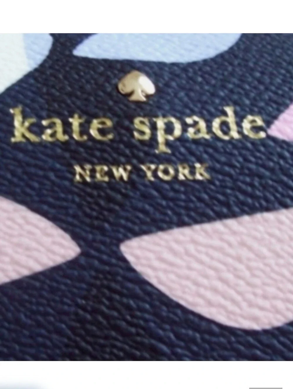 Kate Spade Hawthorne cross-body Carolyn spinner handbag. Navy with pink pinwheel